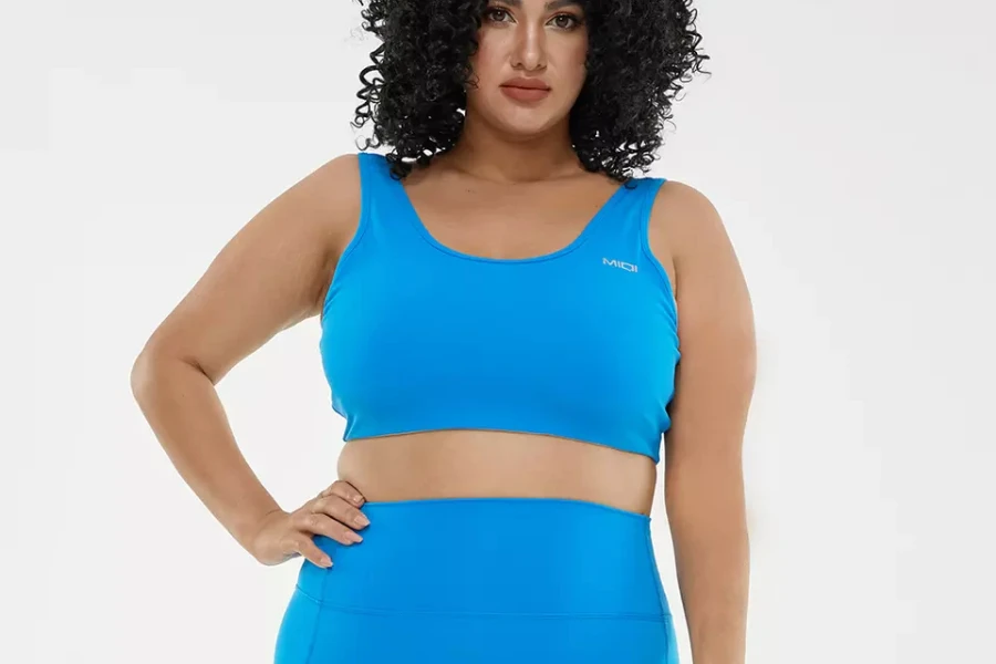 Woman wearing bright blue yoga leggings and crop top